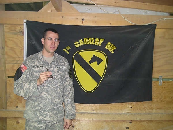 CPT Joe Himpelmann, commander of B Battery, 2-82 Field Artillery takes a cigar break in Mosul, Iraq.