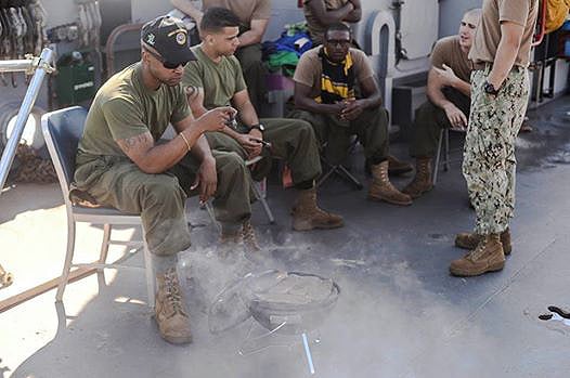 The crew of Landing Craft Utility 1631. L to R: OMC Murray, EM2 Issa, BM2 Nelson and EN2 Kenney.  "Being stationed overseas is stressful, especially in the 7th Fleet, with the highest operation tempo in the Navy. My crew has been deployed since January and take EVERY opportunity we can to enjoy a nice cigar. Thank you for providing shipping to FPO addresses, we would be truly marooned without it."