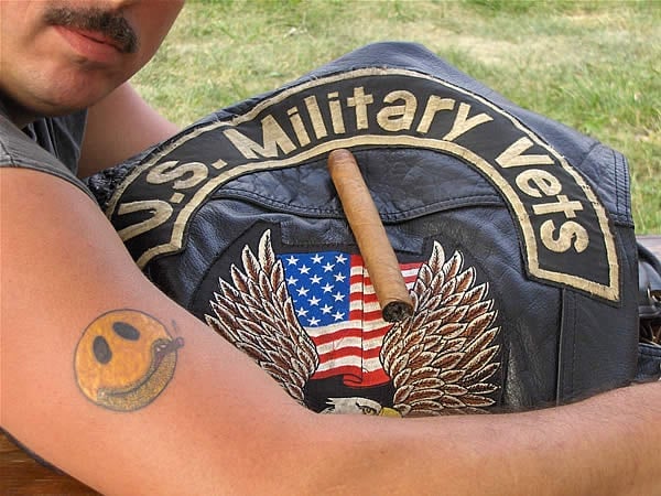 A member of the US Military Vets M/C shows off his new tatoo