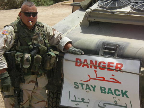 SFC Stephen B. Blair (aka "Hawaiian") of the 100/422 INF Scouts on a routine patrol near Balad, Iraq.