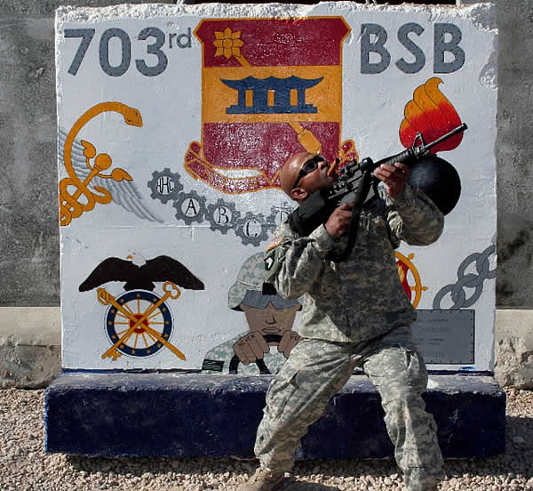 SSG Spencer of 703rd BSB enjoying a nice cigar while providing overhead cover at FOB KALSU, IRAQ.