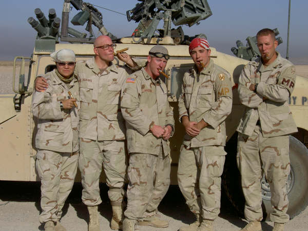This is 1st Squad, 1st Platoon, 810th MP CO (cs). This was our last mission in Iraq. We had to celebrate, so we got us some cigars and went out with a bang.