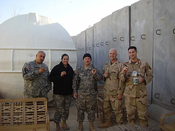From left to right: SGT Miguel Olivas, SSG Corey Fink, LTC Jeffrey Bourne, Capt Jeffery Weak, and TSgt Warren Moran enjoy the first smoke of the new year on New Years Day, 2007 in Camp Victory Iraq.