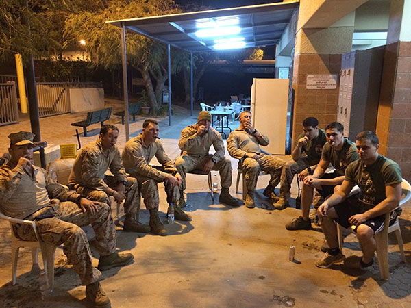 1st BN 1st Marines Delta Co. 1st PLT enjoying a few ACID cigars Yemen April 2014. L to R: SGT Hernandez, HM3 Tzope (Bethlehem PA), SGT Boyles, CPL Rossow, CPL Sereika, CPL Cross, SGT McCraw, CPL Neill. "Myself and a few of my guys ordered up some samplers from one of my favorite hometown places, Cigars International. Thanks gents!"