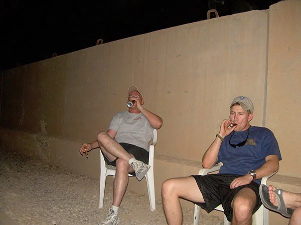 Iraq, SGT Johnson and SGT Scott. "We are enjoying some fine cigars from CI. Thanks CI."