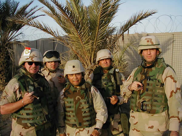 A happy bunch of guys enjoying their cigars at an undisclosed location in Iraq. (L to R)MSgt Tim Sullivan, SSgt Charles Gumbus, LTC Peter Guevara, Maj Melburn Stephens, andMaj Victor Maggio.