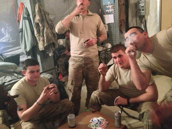 enjoying a game of cards and some cigars.
