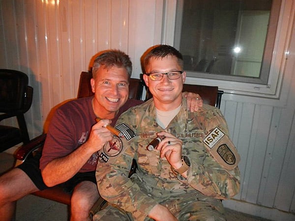 L to R: Brigadier General Michel and TSgt Cody in Afghanistan smoking a Man O War Virtue and an Ave Maria Reconquista during a Labor Day BBQ. "Thank you for all the cigars you have, I know I ordered a ton during my year in Afghanistan."