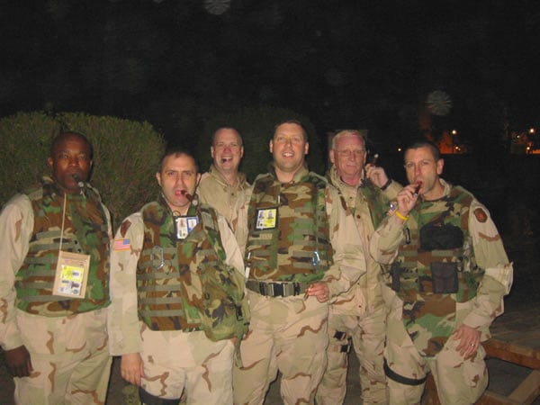 Celebrating a hail and fairwell in Baghdad  members of the Multi National Security Transition Coalition-Iraq.