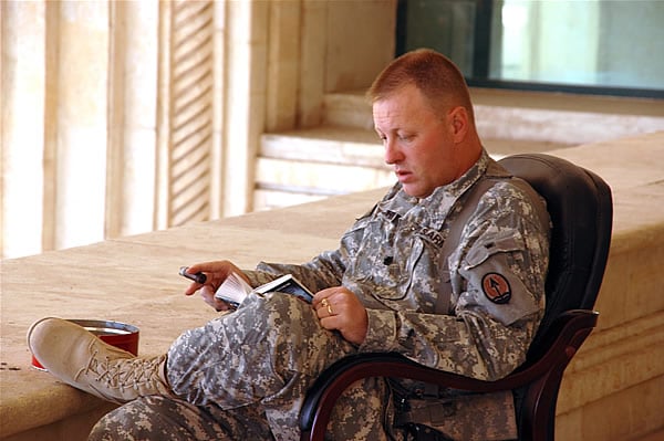 LTC Jeffrey Bourne enjoys two of his favorite pastimes on a beautiful December afternoon in Camp Victory, Iraq.