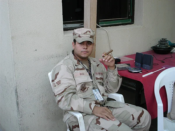 SRA Ruiz of the 380th AEW, United Arab Emirates relaxes with a cigar from CI.