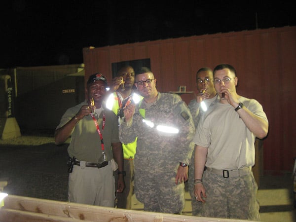 624th MCT personnel: SPC Soto, SPC Downs, PFC Thomas, and Randal, taking a little break enjoying some of CI&rsquo;s best cigars after a good day of work in Iraq.