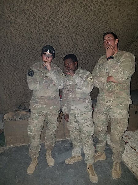 Members of Bandit Troop enjoying some cigars.