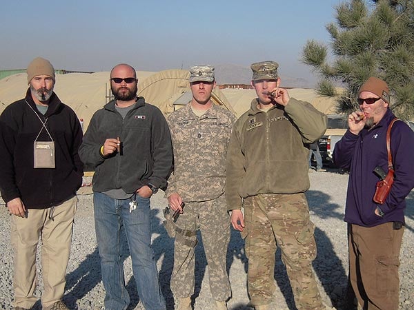 The elite members of the Camp Julien Cigar Club-Kabul, Afghanistan enjoying fine cigars purchased from CI, in celebration of New Year&rsquo;s Day, 2012. From Left to right: Brad Tischler (DoD Civilian), Mike Porche (DoD Civilian), SFC Blake Shaffer (USA), CPT James Lyle (USA), David Gault (DoD Civilian).