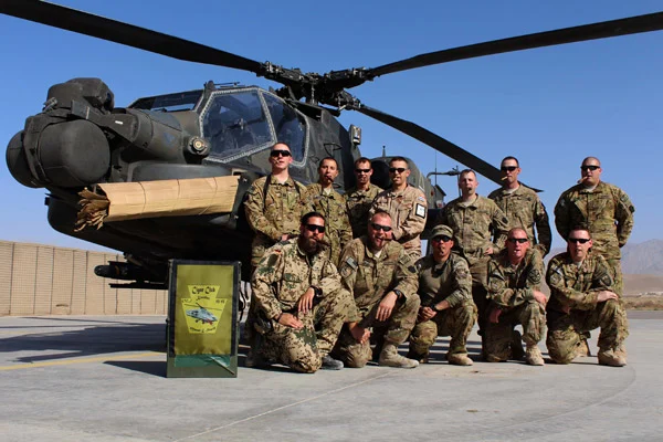Cigar Club members who are part of the PA Guard Aviation unit in Afghanistan. Front Row (L to R): OR6 Tim Totzke, SSG Mark Adams, CW2 Greg Anthony, MSGT Roger Kaley, and CW3 Jeff Braid. Back Row (L to R): Cpt Abe Phares, Spc Saul Grandenetti, CW2 Wyatt Saint, OR4 Igor Loncar, Cpt Steve McGouldrick, Cpt Bryan Donaldson, and CW2 Jeff Toy.  "Smoking the cigars and good conversation made the deployment bearable and helped keep our sanity. Thanks for shipping us the cigars we ordered from you (there were MANY we ordered from you guys)."