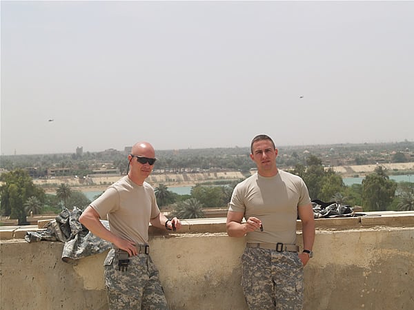 Army MAJ. Troy Heineman and Navy LT. Reo Hatfield on the rooftop of FOB Union III, Baghdad,Iraq enjoying some 5 Vegas Series "A" cigars. "A smoke a day keeps the mortars away"