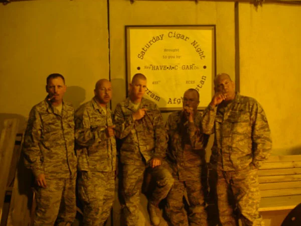 TSgt. Kevin Maier and a few buddies smoking Victor Sinclair, Afghanistan, the night before heading out to a forward operating base.