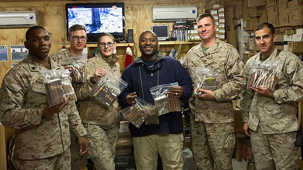 "Again, thank you very much for your donations to the Warriors here at Camp Leatherneck. The picture submitted is from one of the coldest nights we have had here yet and it was below 20 degrees. Everyone was impressed with the cigars and I kept hearing "oh, this is a good one" as they went through them. The group may appear small but again with missions going on, we have between 20 and 50 show up every Sunday. The West Coast is showing up to replace the East Coast as we speak, so the club will continue, much of it is due to your help."