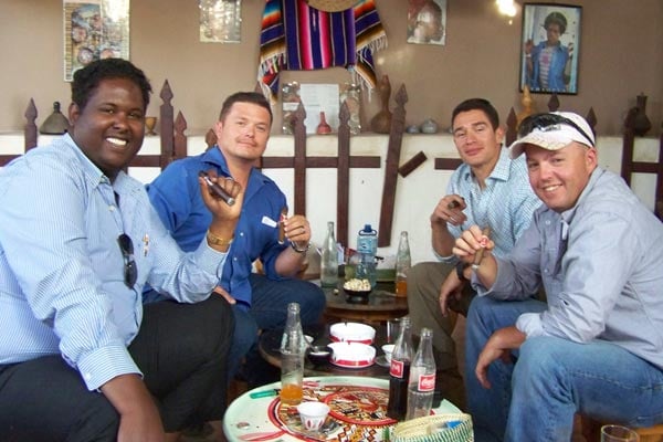 L-R: Marshall, our interpreter. HM1 Michael Smaltz, LTJG Jose Mora and EO1 Tim Finnicum of the Naval Mobile Construction Battalion 74 enjoying some well deserved liberty while being deployed in Ethiopia.
