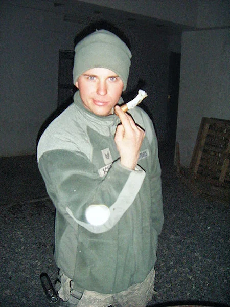 SSgt Jordan Scheller in Afghanistan smoking a Perdomo Lot 23. "Thank you for your support of the troops and for the great service you provide us."