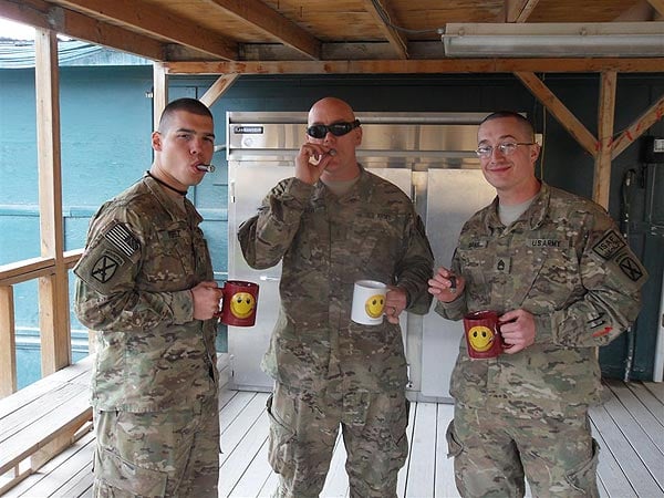 Dear CI,These pictures were taken on 30 JAN 2011 (my birthday) at an airfield in Afghanistan. We wanted to give a shout out to Cigars International by posing with your mugs to thank you for your support of the Troops as well as your quick and efficient ordering and delivery.Thanks again!v/r,-Sergeant First Class Rodney K. AdamsUnited States Army10th Mountain Division