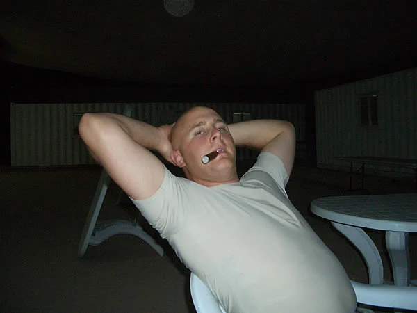 SPC Stroka enjoying a series 55 Red Label (corojo) from CI in COB Speicher, Iraq.