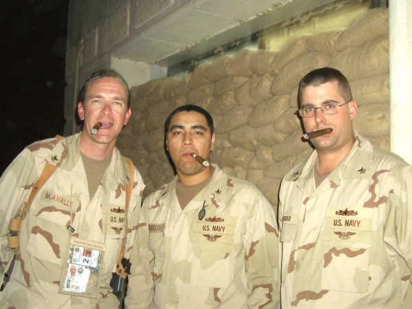 LN2(SW/AW) Steven D. McAnally, LN2(SW/AW) Marcelo Carrillo, and LN1(SW/AW) Jeffery T. Baugher of the United States Navy, currently stationed inBaghdad, Iraq at Camp Victory.
