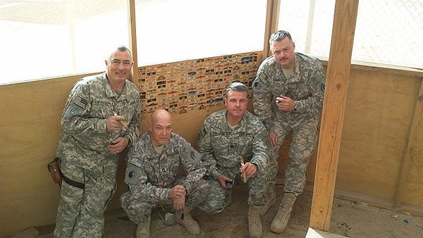 CW4 Di Pasquale, SFC Lupien, 1SG Cavanaugh and SSG Dion enjoying a cigar break during OIF, Kuwait."Thanks for the awesome support from CI"