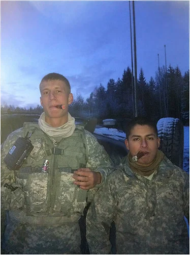 "(L to R) PFC. Klender and PFC. Aguirre, with the 1-91 CAV 173rd (ABCT), taking a  break from training with two cigars from CI in Germany."