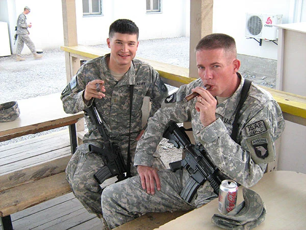 101st Airborne, enjoying cigars in Afghanistan.
