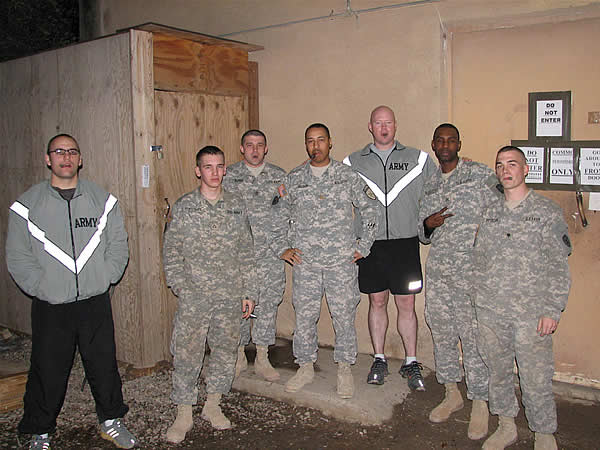 This is of some of the 2-35 IN BN S6 shop enjoying a Punch cigar to celebrate LCDR Wilson going home after serving a year in Iraq.
