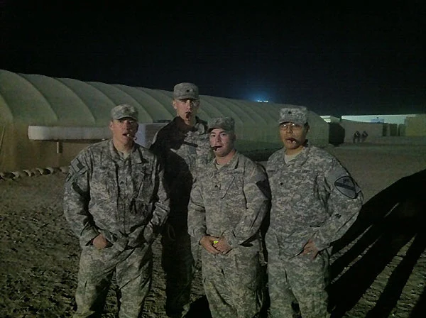 From left to right; SGT Hayes, SPC Rhoades, SGT Woznack, and SPC Granillo. Christmas Eve/ End of operations in Iraq celebratory cigars. Taken in Kuwait.