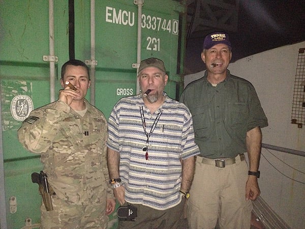 "USAF Capt Mike Lasorda, DOD Civilian David Gault (USN Ret), and Army Civilian Mark Kerry (USA Ret) enjoy fine Gurkha cigars in celebration of the 238th Birthday of the United States Army; Afghanistan."