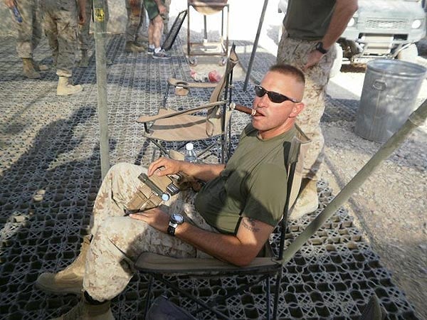 Gunny Granger relaxing with a cigar in Afghanistan.