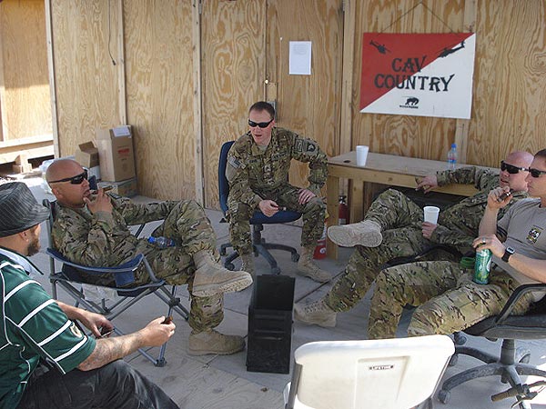 Troopers from D Troop, 7-17 CAV (TF Palehorse) enjoying some cigars in Afghanistan.
