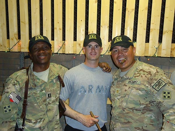 "The Dirty Dozen Cigar Club celebrates another &rsquo;Juma&rsquo; in Afghanistan with some cigars from CI." CPT Davis, CPT Holloway and MAJ Keahtigh smoke it up in the ARV with some tasty smokes from CI.