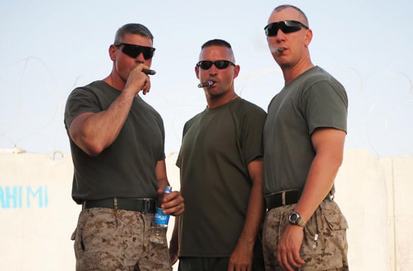Senior Chief Nate Whiddon, GySgt Mike Granger, and Chief TJ Kmetz enjoying a cigar in sunny Afghanistan.