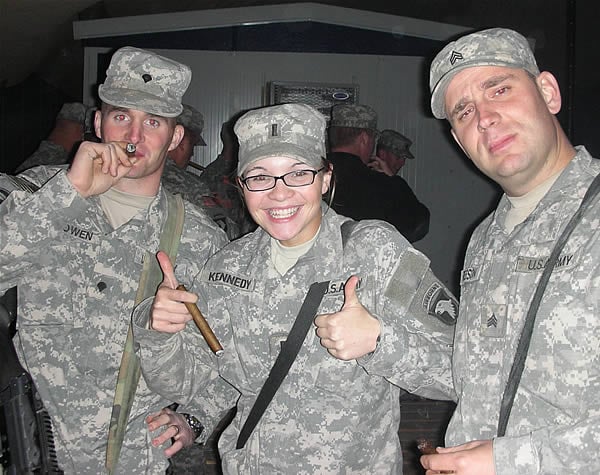 From left to right: SPC Cowen, 2LT Kennedy, and SGT Reeson enjoying cigars from CI while in Iraq.