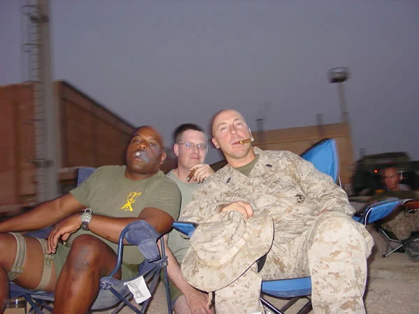 Left to Right:  LTJG Simpkins, LTJG Cooper, Chief Spence, LT Clark of Forward Resuscitative Surgery System 2 / Shock Trauma Platoon 4 (FRSS2/STP4) enjoying the forbidden pleasures of  their Habana Romeo Y Julieta #1&rsquo;s. Al Anbar Province, Iraq, September 2004.