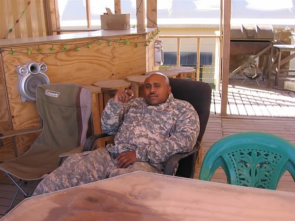 SSG Green enjoys a fine cigar while relaxing at Foward Operating Base Salerno Afghanistan.