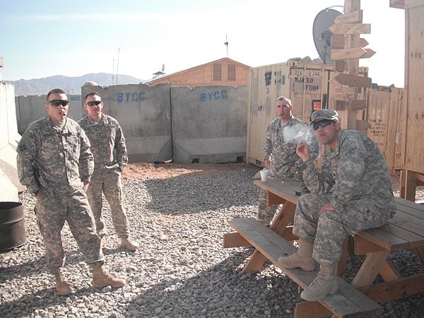 SGT Zic, SFC Scopazzo, 1LT Wilson and CPT Rossol enjoy a daily smoke in Afghanistan.