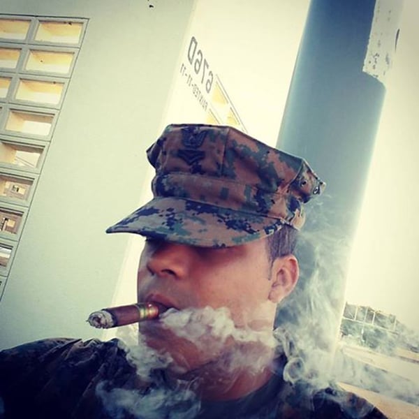 PO2 Dixon enjoying a cigar.