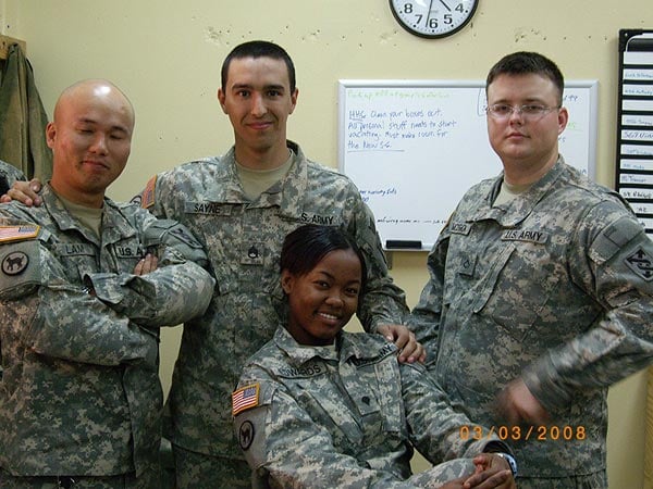 Soldiers from S6 section HHC, 787th CSSB from Dothan, AL share a group photo while stationed in Iraq.