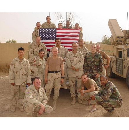 Second Lieutenant John Bardunias (the one standing in dark camo)and the 144 ADA (Aircraft Defense Artillery) Delta Battery.