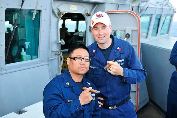 Brandon Cummings and his chief taking a break from a long day on USS BARRY DDG-52, while deployed to the Mediterranean Sea. "Enjoying cigars purchased from C.I. Thanks!"