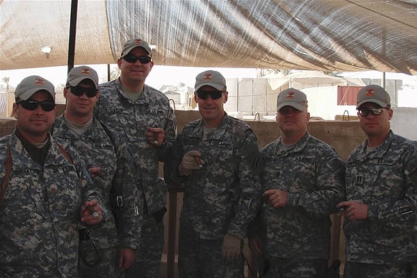MAJ Brosky, CPT Olmstead, MAJ Byler, LTC Chadbourne, CSM Jeffries, CPT Hoisington of the 703d Brigade Support Battalion enjoy their cigars at FOB KALSU, Iraq in December 2007.